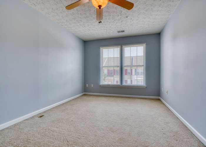 4900 Villa Point, second bedroom with ceiling fan